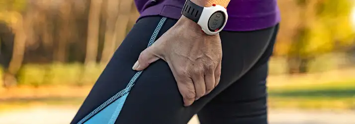 Chiropractic Gilbert AZ Leg Pain A person holding their upper thigh.
