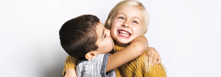 Chiropractic Gilbert AZ Smiling Kids A young boy and girl hugging.