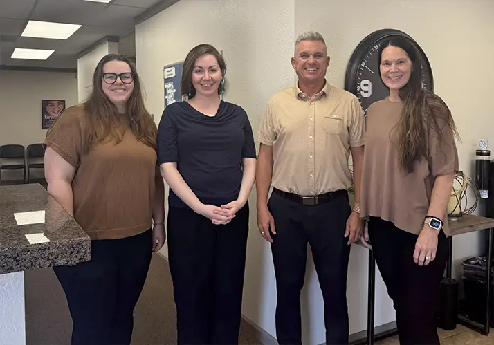 Chiropractor Gilbert AZ David Campbell With Team Dr. David Campbell smiling with his team.